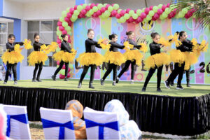 Students wearing traditional colorful dresses of Balochistan during Learning Festival 2024 at a School