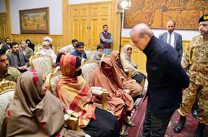 Prime Minister Muhammad Shehbaz Sharif interacting with the families of the deceased and injured in the wake of recent torrential rains and heavy snowfall