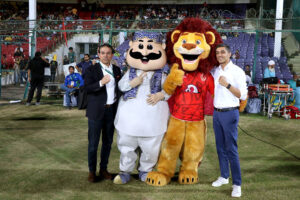 Owners of Islamabad United and Multan Sultans posing with their team logos before the Pakistan Super League (PSL) Twenty20 final cricket match at the National Stadium
