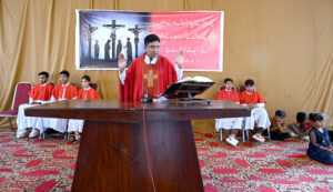 Bishop of Fatima Church performing religious rituals on Good Friday Day.