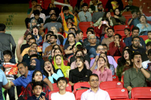 People enjoying the Pakistan Super League (PSL) Twenty20 cricket final match between Islamabad United and Multan Sultans at the National Stadium
