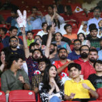 People enjoying the Pakistan Super League (PSL) Twenty20 cricket final match between Islamabad United and Multan Sultans at the National Stadium
