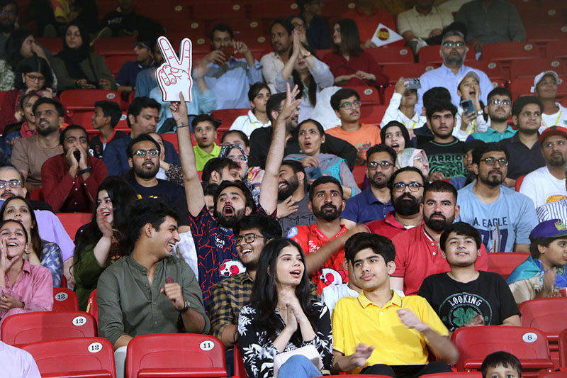 People enjoying the Pakistan Super League (PSL) Twenty20 cricket final match between Islamabad United and Multan Sultans at the National Stadium