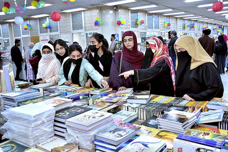 Students taking keen interest in books at a stall during the 5 days “Book Fair” at University of Agriculture Faisalabad (UAF)