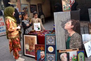 Students viewing the displayed stuff during the organized by the Farmer School System at light Door