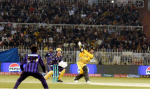 Peshawar Zalmi batter Babar Azam play a shot during the Pakistan Super League (PSL) Twenty20 cricket match at the Rawalpindi Cricket Stadium