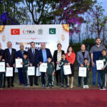 Country Coordinator of TiKA (Turkish Cooperation and Coordination Agency), Muhsin BALCI and other team members presenting gifts to the orphan children of Pakistan Bait-ul-Mal Sweet Home after an Iftar Dinner jointly organized by PBM and TiKa on the eve of World Orphans Day
