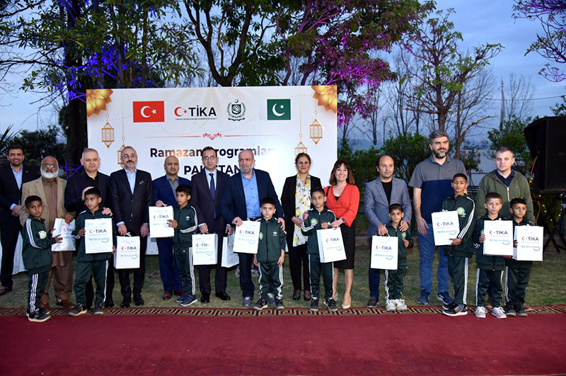 Country Coordinator of TiKA (Turkish Cooperation and Coordination Agency), Muhsin BALCI and other team members presenting gifts to the orphan children of Pakistan Bait-ul-Mal Sweet Home after an Iftar Dinner jointly organized by PBM and TiKa on the eve of World Orphans Day