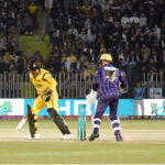 Peshawar Zalmi batter Babar Azam play a shot during the Pakistan Super League (PSL) Twenty20 cricket match at the Rawalpindi Cricket Stadium