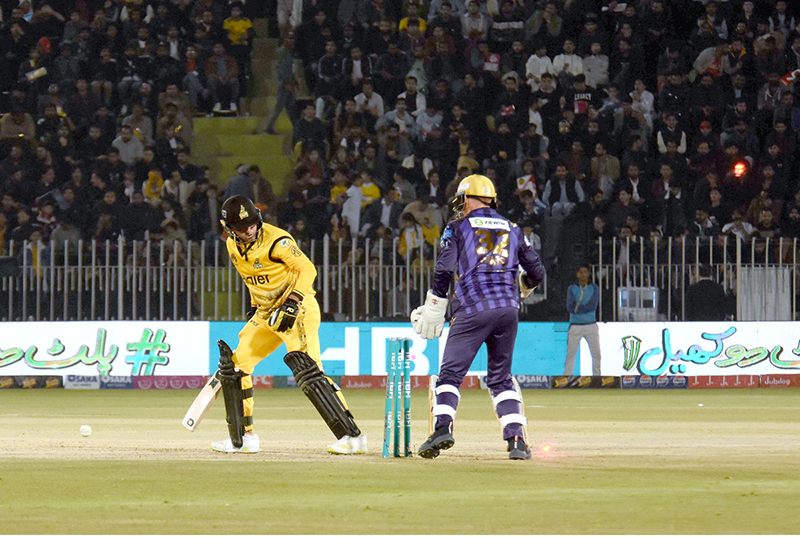 Peshawar Zalmi batter Babar Azam play a shot during the Pakistan Super League (PSL) Twenty20 cricket match at the Rawalpindi Cricket Stadium