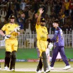 Peshawar Zalmi batter Babar Azam celebrates his half century (50 runs) score during the Pakistan Super League (PSL) Twenty20 cricket match at the Rawalpindi Cricket Stadium