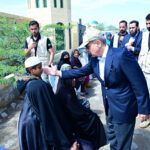 Prime Minister Muhammad Shehbaz Sharif consoling the affectees of torrential rains at a relief camp