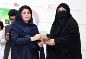 Students performing in a tableau during Yom-e- Pakistan function, organised by District Administration at Begum Nusrat Bhutto auditorium Hall Jinnah Bagh
