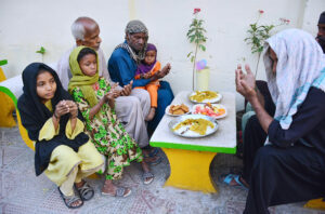 Volunteers distribute food among the people in fast during the Holy Month of Ramadan at Hussainabad