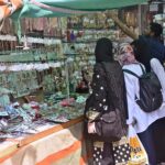 Women purchasing artificial jewelry from a roadside stall for Eid ul Fitr Festival