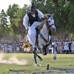 Horse rider participating in Tent-Pegging competition during opening ceremony of annual Sports Gala of University of Sargodha.