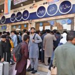 People purchasing tickets and waiting for transport to travel their hometowns to celebrate Eid ul Fitr with their loved ones at Faizabad Bus Stand.