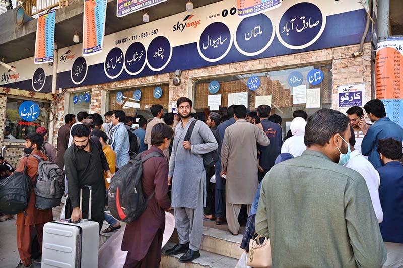 People purchasing tickets and waiting for transport to travel their hometowns to celebrate Eid ul Fitr with their loved ones at Faizabad Bus Stand.