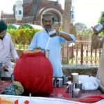 A vendor selling a traditional summer drink (Lassi) at the roadside