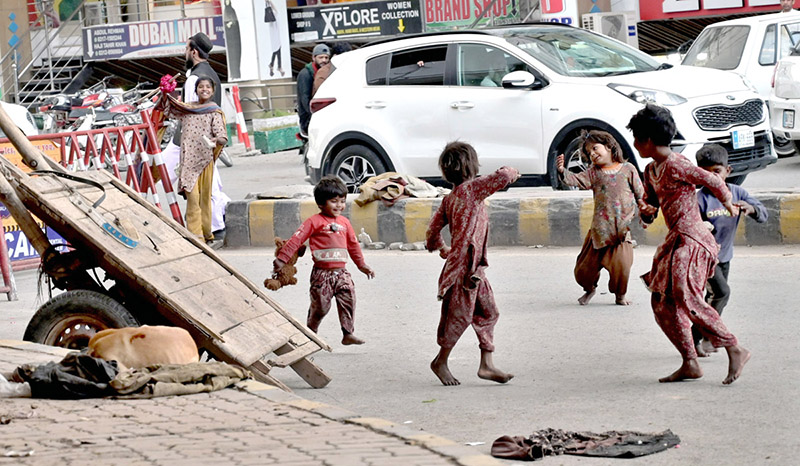 Gypsy children playing on 6th Road during morning time.
