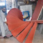 A worker busy in making iron stair at his workplace, IJP Road