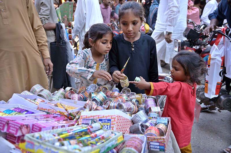 Young girls are busy in selecting bangles from a stall at Urdu Bazaar in connection with upcoming Eidul Fitr.
