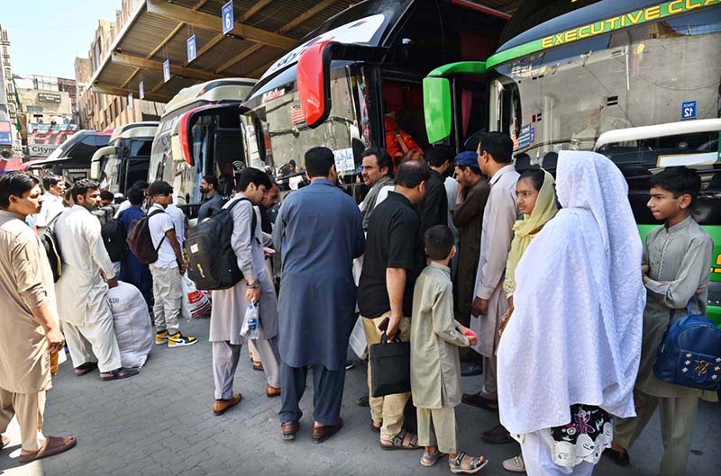 People purchasing tickets and waiting for transport to travel their hometowns to celebrate Eid ul Fitr with their loved ones at Faizabad Bus Stand.