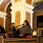 Folk singer Sanum Marvi performing song on stage during music night at Basant hall