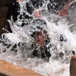 Youngsters are enjoying bathing in tube well to get relief from hot weather in the city