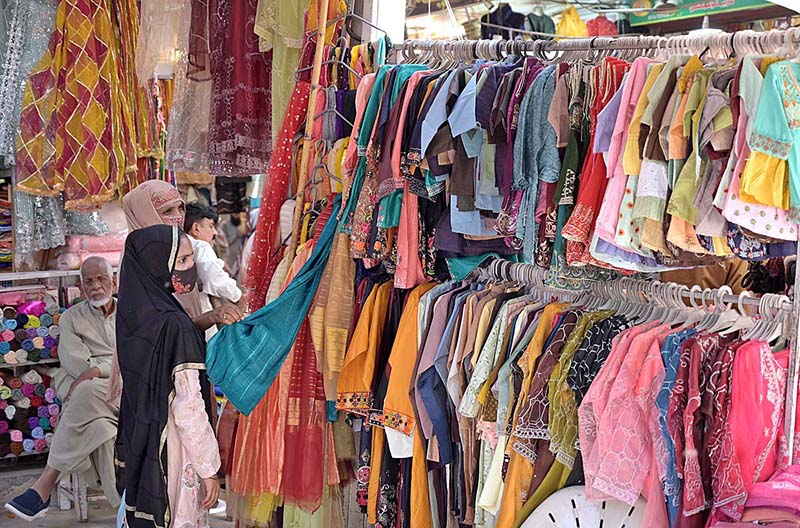 Young girls are busy in selecting bangles from a stall at Urdu Bazaar in connection with upcoming Eidul Fitr.