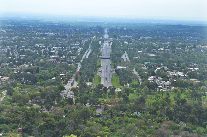 Foreigners enjoy bird eye view of the federal capital from the picnic point Daman e Koh.