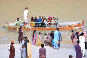 A large number of people visit the bank of River Indus
