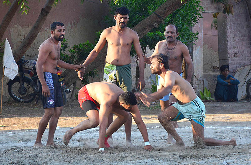 Players in action during Kabaddi match playing between Punjab and Sindh teams at Qasimabad Sports Complex