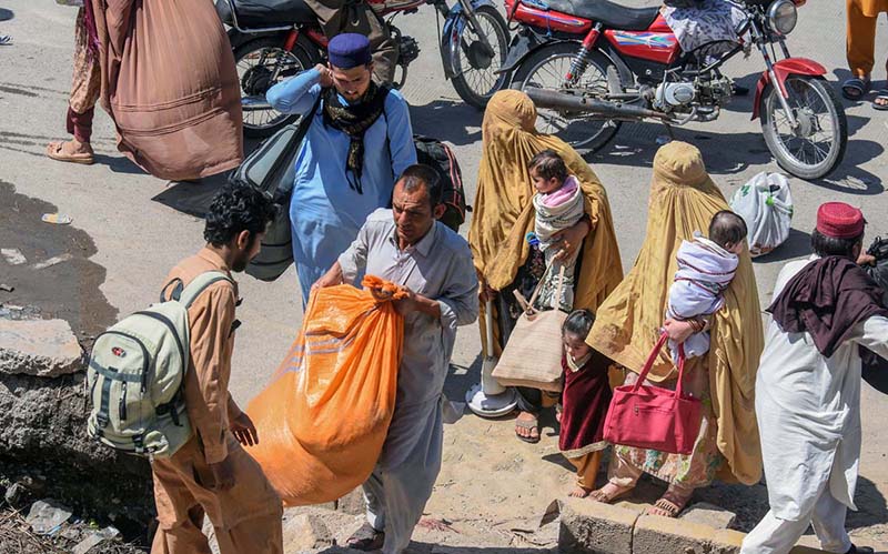 People purchasing tickets and waiting for transport to travel their hometowns to celebrate Eid ul Fitr with their loved ones at Faizabad Bus Stand.
