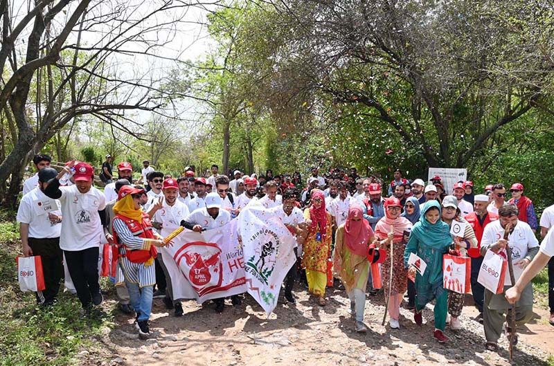 Representatives of PRCS, IFRC, ICRC, Norwegian Red Cross, Turkish Red Crescent, German Red Cross and volunteers participating in hiking on the occasion of World Hemophilia Day at Margalla Hills, Trail 5 in Federal Capital.