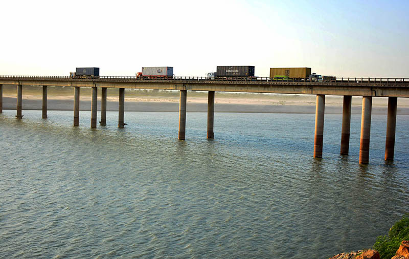 A view of heavy vehicles passing through the bridge on the Indus River at the Bypass area