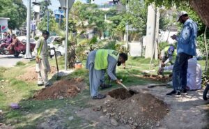 CDA workers drilling with machine for plantation in greenbelt along IJP Road.