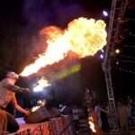 A person blowing fire from mouth during Flora Festival organized by PHA