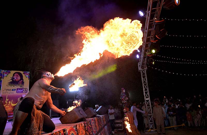 A person blowing fire from mouth during Flora Festival organized by PHA