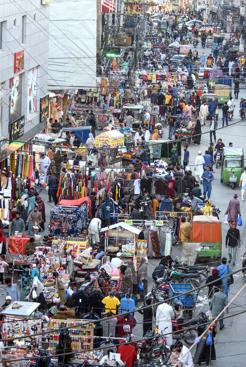 People are busy in shopping for Eid ul Fitr Festival at Commercial Market