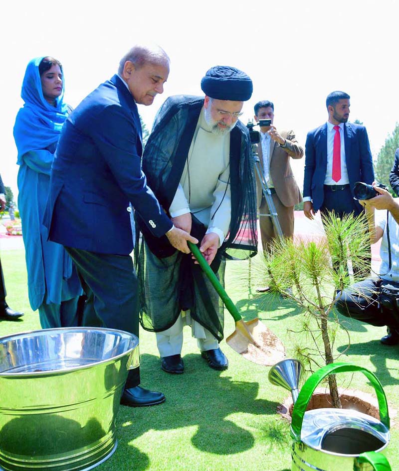 Prime Minister Muhammad Shehbaz Sharif and Iranian President H.E. Dr. Syed Ebrahim Raisi plant a tree in a the lawn of Prime Minister House in view of Earth Hour.