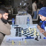 Chess players participating in chess competitions during the first South Punjab chess tournament at the Railway Club organized by the Chess Association of Punjab