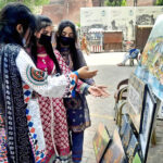 Visitors keenly viewing Painting & Calligraphy Exhibition organized by the The Formanite School System in collaboration with Walled City of Lahore Authority