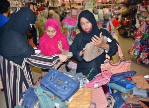 Deserving girls busy shopping in preparation of upcoming Eid ul fitr arrange by Al-Khidmat foundation at Dawood shopping mall.