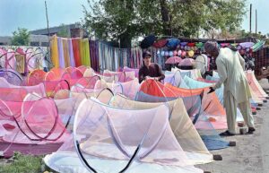 A roadside vendor displaying mosquito nets to attract the customers.