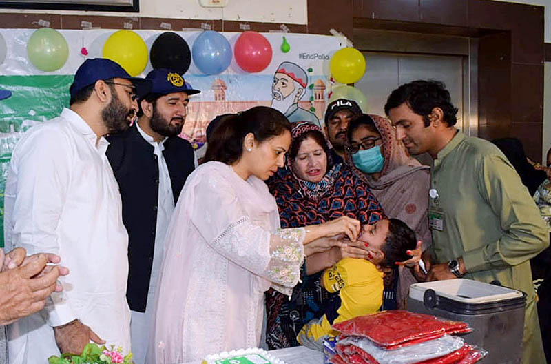 Commissioner Maryam Khan is administering Polio Drops to a child during the inauguration of the 5 Days Anti-Polio Campaign, during the Campaign of 1 million children will be administered polio drops in Multan district.