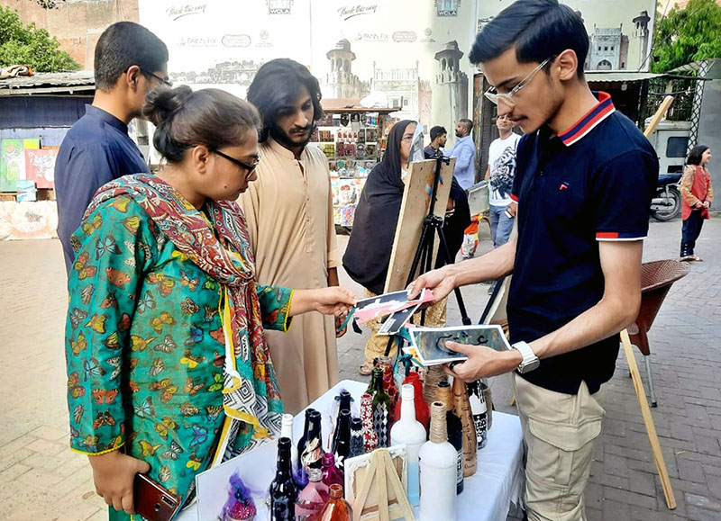 Visitors keenly viewing Painting & Calligraphy Exhibition organized by the The Formanite School System in collaboration with Walled City of Lahore Authority