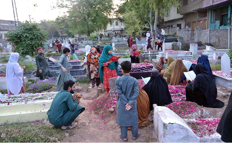 A vendor displaying flowers at temporary stall near I-9 graveyard as a large number of people visit graveyards on Eidul Fitr to offer Fateha on graves of their family members.