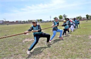 Players participating in tug-of-war competition during Inter Girls Collegiate Tug-of-War Tournament organized by Education Board Sargodha.