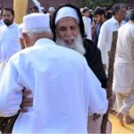 People exchanging Eid greetings with each other after offering Eidul-Fitr prayer at I-9 local park